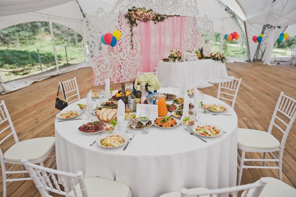 Company picnic setup with tables and chairs in a Toronto park
