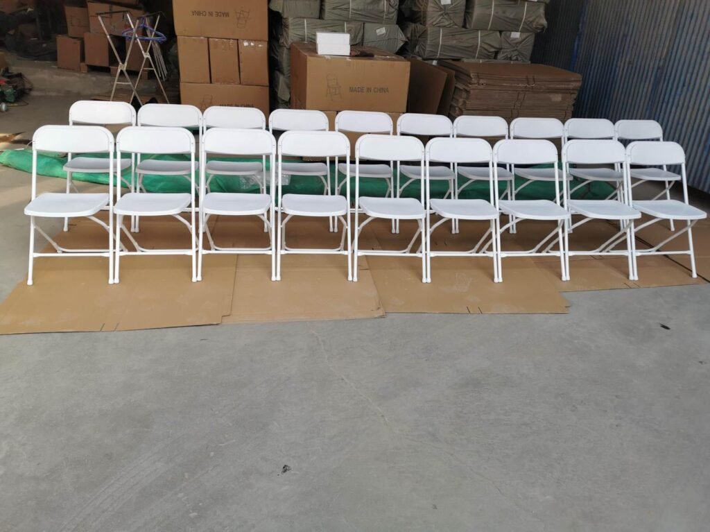 White folding chairs set up by a Toronto party rental company